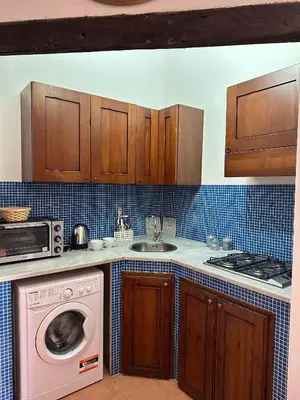 a kitchen with a washing machine and a sink at Art Lincoln in Palermo
