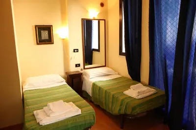 a hotel room with two beds and a mirror at Art Lincoln in Palermo