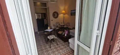 a hallway with a room with a living room at Eureka in Palermo