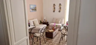 a living room with a couch and chairs and a table at Eureka in Palermo