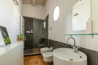 a bathroom with a sink and a toilet at Cala Loft by Wonderful Italy in Palermo