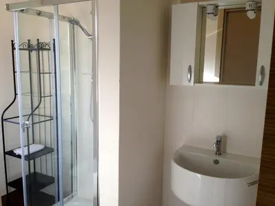 a bathroom with a sink and a shower at Appartamento Il Pomodoro in San Vito lo Capo