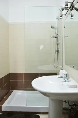 a bathroom with a sink and a shower at Lercarappart in Lercara Friddi