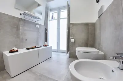 a white bathroom with a sink and a toilet at Palermo al Centro - Appartamento Vittorio in Palermo