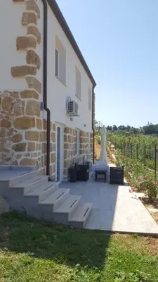 a patio with a chair and a building at Maresol in Trappeto