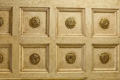 a wooden door with gold patterns on it at Locanda del Gagini in Palermo