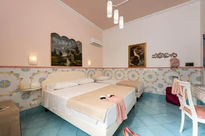 a bedroom with a large bed in a room at Albert Rooms & Breakfast in San Vito lo Capo