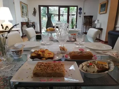 a table with many different types of food on it at B & B Villa Flora in Mondello