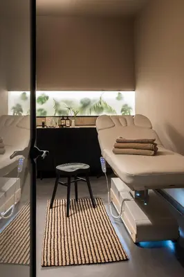 a hospital room with two beds and a stool at Hotel Plaza Opéra in Palermo