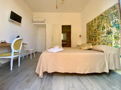 a bedroom with a large bed in a room at Via Siracusa 5 in Castellammare del Golfo