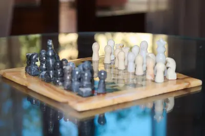 a chess set on top of a wooden table at L'Attico di Gizi in Palermo