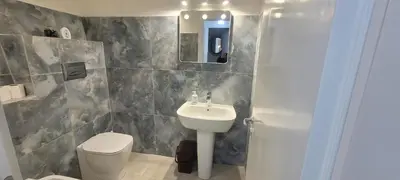 a bathroom with a sink and a toilet at A un passo dal Massimo in Palermo