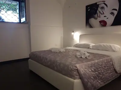 a bedroom with a bed with two towels on it at A un passo dal Massimo in Palermo