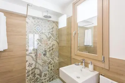 a bathroom with a sink and a shower at Catalina in San Vito lo Capo