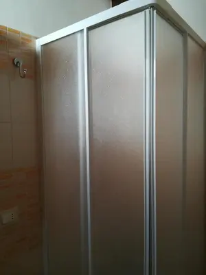 a shower stall with a sliding glass door in a bathroom at Vicino al mare e lontano dai rumori in Alcamo Marina
