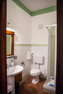 a bathroom with a toilet and a sink at Palazzo Q-tò in Monreale