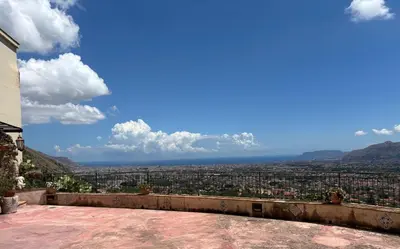 a view of the city from the roof of a house at Palazzo Q-tò in Monreale