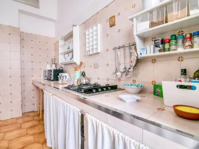 a kitchen with a stove and a counter top at Liberty Apartment in Palermo