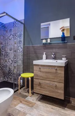 a bathroom with a sink and a toilet and a shower at Politeama Luxury Suites in Palermo