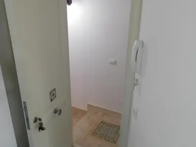 a door to a bathroom with a shower in a room at Residenza del Mare & SPA in San Vito lo Capo