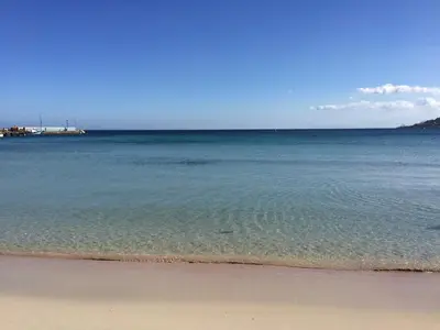 a view of the ocean with the sand and water at House in Mondello in Mondello
