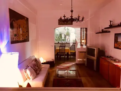 a living room with a couch and a table at House in Mondello in Mondello