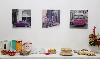 a table with bread and pastries and a bike on a wall at Rest and Go in Palermo