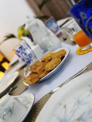 a table with a plate of cookies on a table at Rest and Go in Palermo