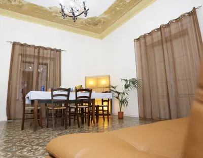 a dining room with a table and chairs at Rest and Go in Palermo