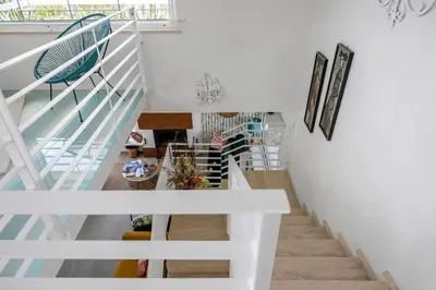 a staircase with white railings and a white stair case at Villa Bonifato vista sulle campagne e sul mare siciliano COZY HOUSE ITALY in Alcamo
