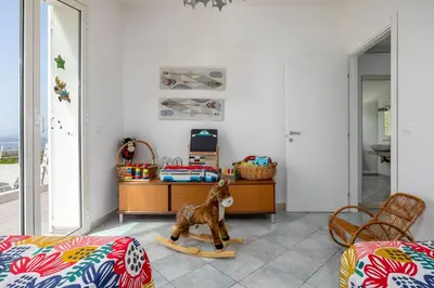 a living room with a toy horse on a skis at Villa Bonifato vista sulle campagne e sul mare siciliano COZY HOUSE ITALY in Alcamo