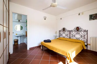 a bedroom with a bed and a sink in a room at Panoramica Blu in Palermo