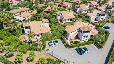 an overhead view of a house with cars parked in a driveway at Arvilla's Houses in Campofelice di Roccella