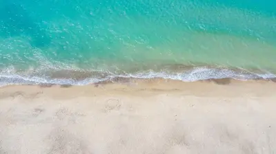 an overhead view of a beach with the ocean at Arvilla's Houses in Campofelice di Roccella
