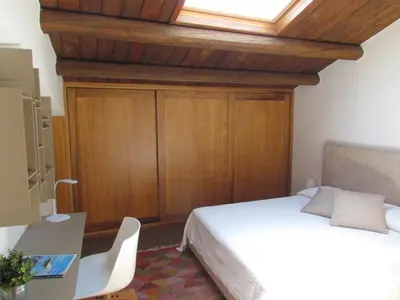 a bedroom with a bed and a skylight at Appartamento Alloro 2 in Palermo