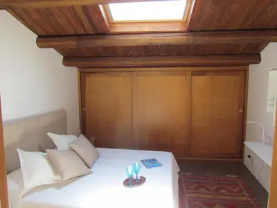 a bedroom with a bed with a wooden ceiling at Appartamento Alloro 2 in Palermo