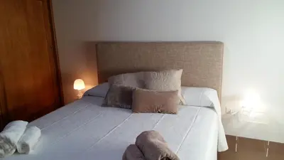 a bed with two stuffed animals laying on it at Appartamento Alloro 2 in Palermo