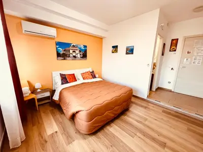 a bedroom with a large bed with a large window at LeAlbe di Sicilia in Palermo