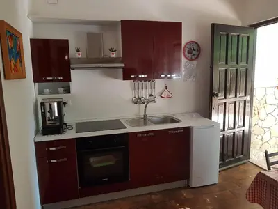a kitchen with a sink and a stove top oven at Villa Ania in Mondello