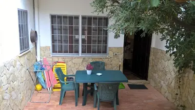 a blue table and chairs in front of a house at Villa Ania in Mondello
