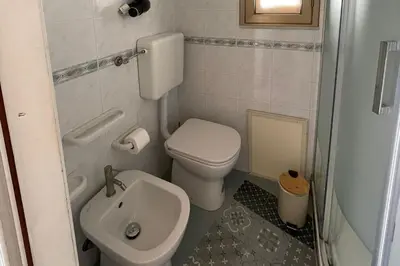 a small bathroom with a toilet and a sink at 