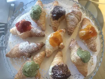 a plate of pastries on a table at B&B Mondello Design in Mondello