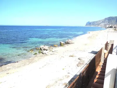 a view of a beach with the ocean at Bilocale Lungomare Carini in Carini