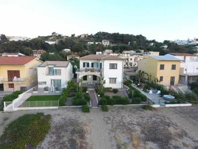 an aerial view of a house in a city at Dune Home alloggi sul mare in Alcamo Marina