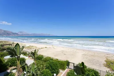 a view of a beach with the ocean at Dune Home alloggi sul mare in Alcamo Marina