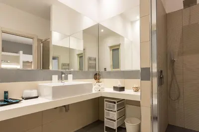 a bathroom with a sink and a mirror at Palermo ai Leoni in Palermo