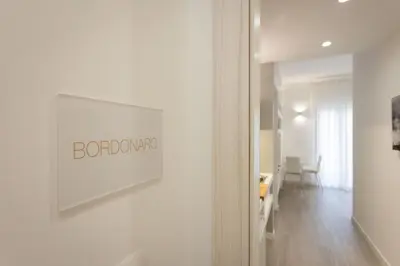 a white room with a sign on a wall at Palermo ai Leoni in Palermo