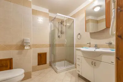 a bathroom with a toilet sink and a shower at Hotel Castello di Giuliano in Montelepre