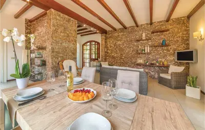 a dining room with a table with a bowl of fruit on it at Villa Belvedere in Sambuca di Sicilia