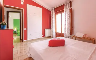 a red bedroom with a bed with a red box on it at Villa Belvedere in Castellammare del Golfo